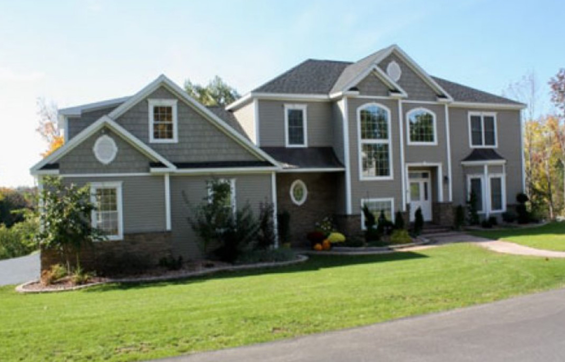 A large house with many windows and doors.